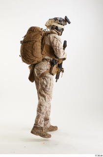 Casey Schneider Paratrooper in Desert Marpat with Gun standing walking…